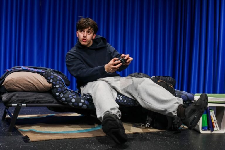 A performer delivering the Crossing the Line monologue to primary school pupils
